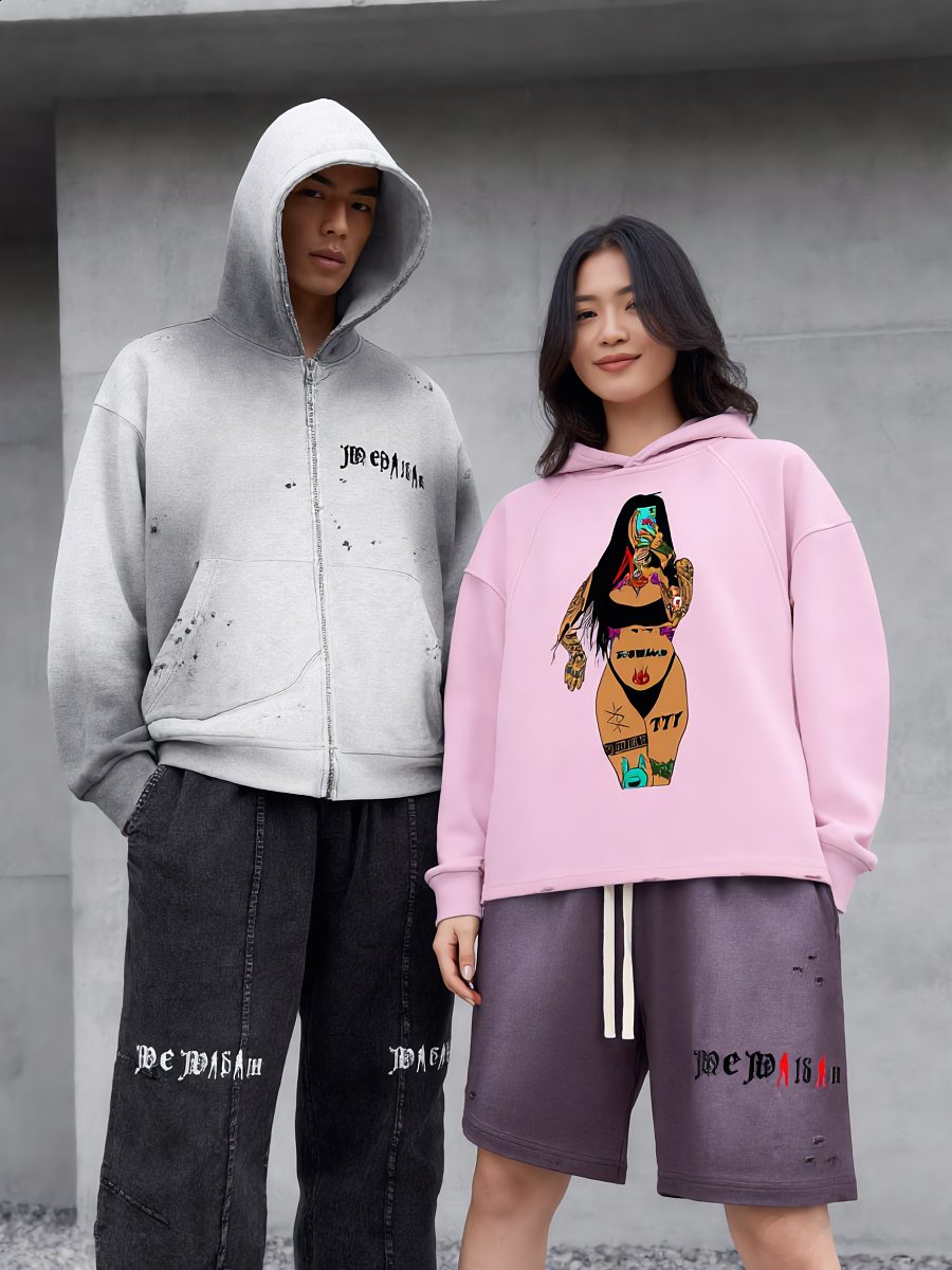 Two models in a distressed grey zip hoodie and a pink graphic hoodie with purple shorts