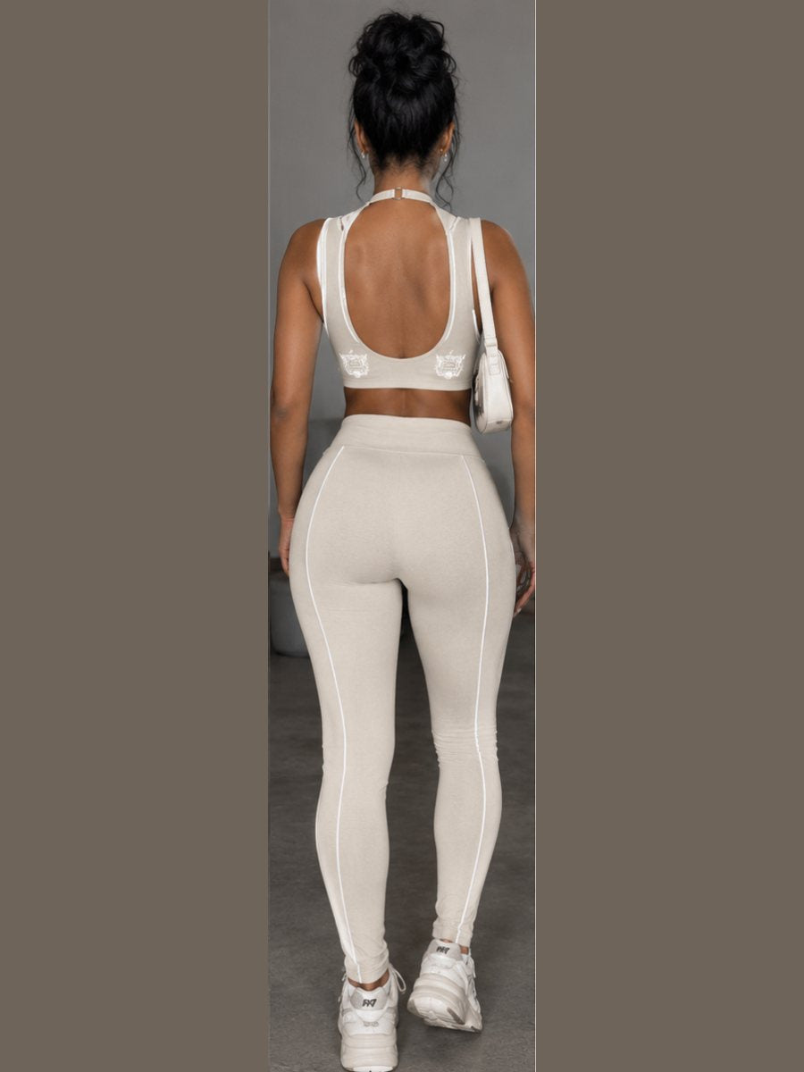 Back view of the tan open-back sports bra and leggings set