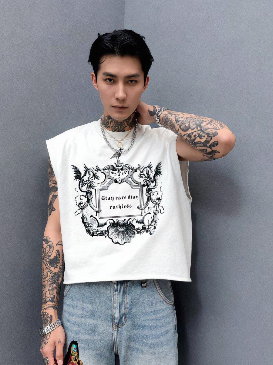 Tattooed model in the cropped white crest tank against a grey wall