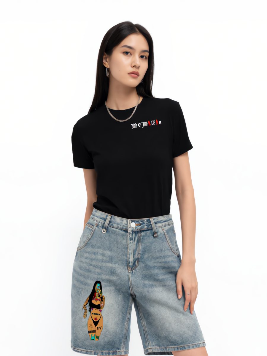 Model in a black We Wildin tee and the graphic denim shorts